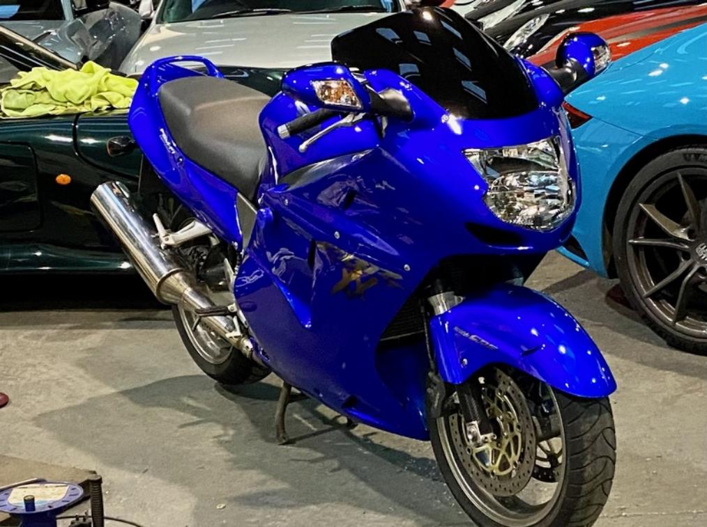 A blue sports motorbike stored with us as we also store these .